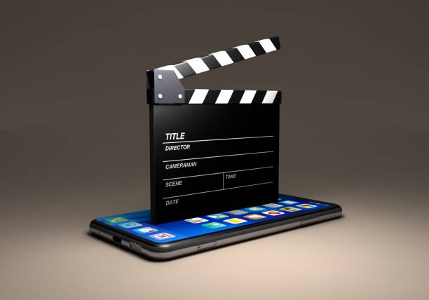 A clapperboard placed on a smartphone stock photo
