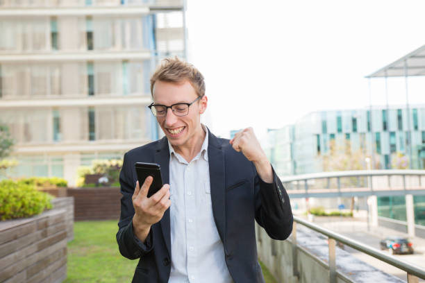 istock Excited positive office employee receiving message 1164881565