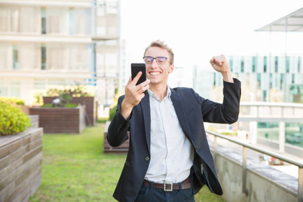 istock Excited cheerful manager rejoicing at message 1164883706