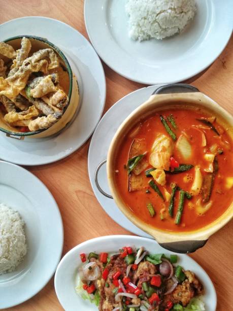 istock Red vegetable curry, deep-fried soft shell crab and deep-fried fish skin with salted egg yolk 1164883748