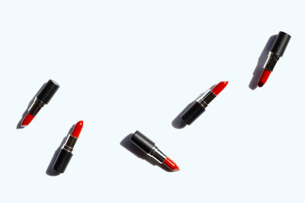 istock Flat lay composition, Lipsticks on white background with shadow. Beautiful Make-up concept 1164884098