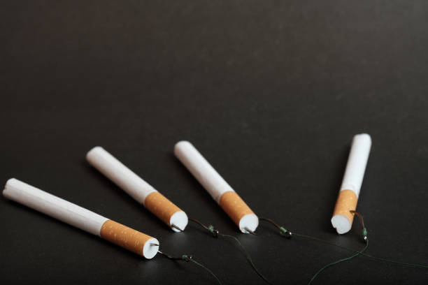 istock unfolded on a dark background cigarette filter forward to the cigarette filter fit fishing hooks 1164884204
