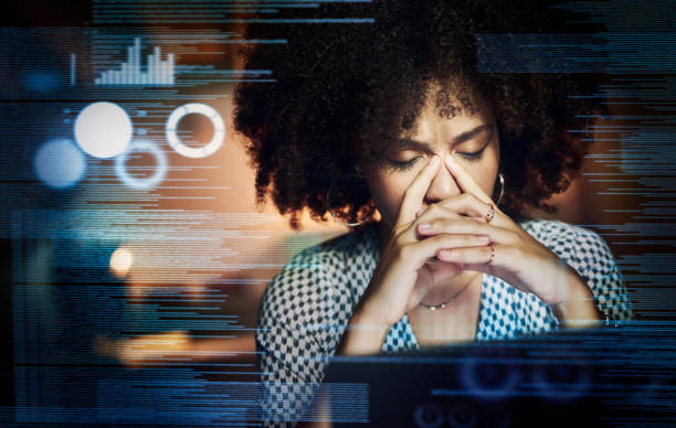 Information overload Shot of a young female programmer looking stressed out while working late in her office information overload photos stock pictures, royalty-free photos & images