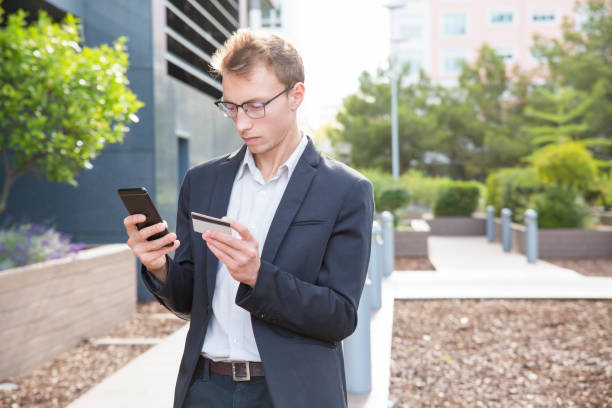 istock Focused customer buying goods online 1164885560