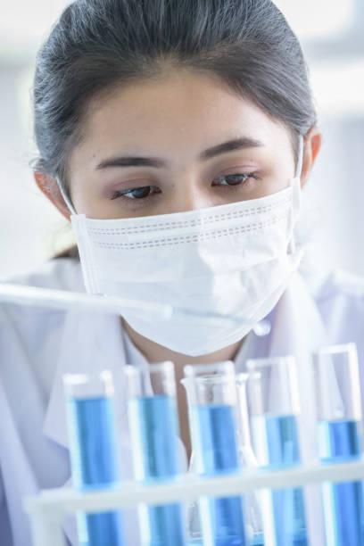 istock Asian young girl student scientist researching  and learning in a laboratory. 1164885815