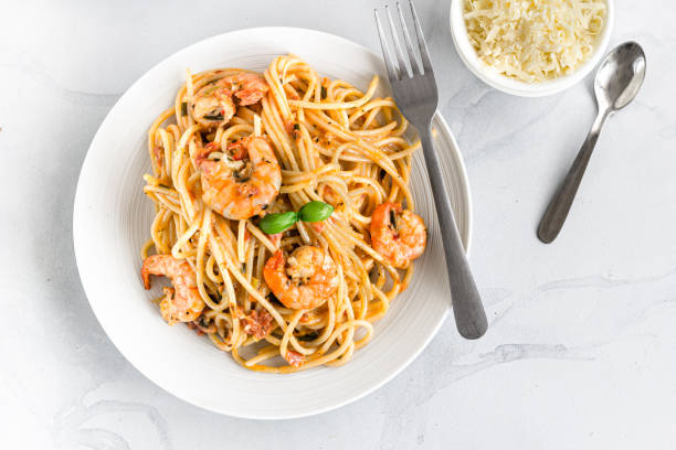 istock Shrimp Spaghetti Pasta on a White Plate and White Background Directly Above Photo. 1164886387