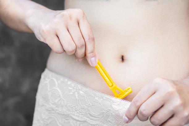 woman body wearing panty shaving public hair by razor blade closeup woman body wearing panty shaving public hair by razor blade closeup razor blade stock pictures, royalty-free photos & images