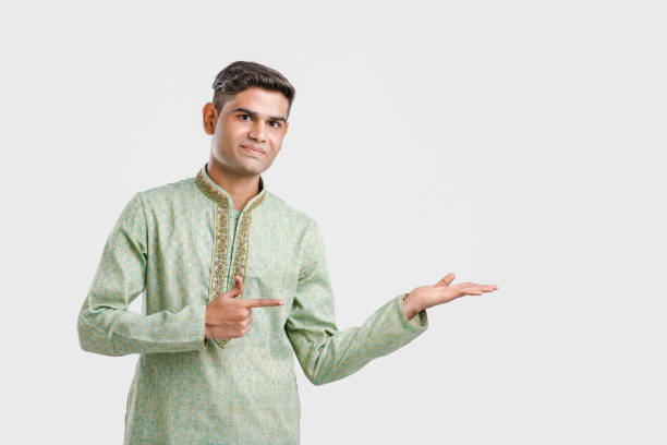 istock Indian man in ethnic wear and Showing Direction 1164890007