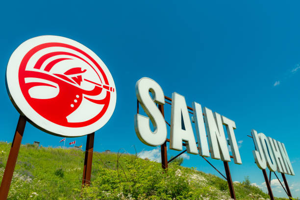 Saint John Sign Saint John, NB, Canada - July 20, 2019: The "Saint John" sign overlooks the harbor from Fort Howe. The cities "Loyalist" logo is to the left of the sign. The sign was installed in 1999. st john's plant stock pictures, royalty-free photos & images