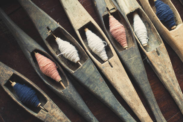 Vintage filling carriers of the loom with spool of colorful threads inside. Used by Laotian craftsmen in Luang Prabang