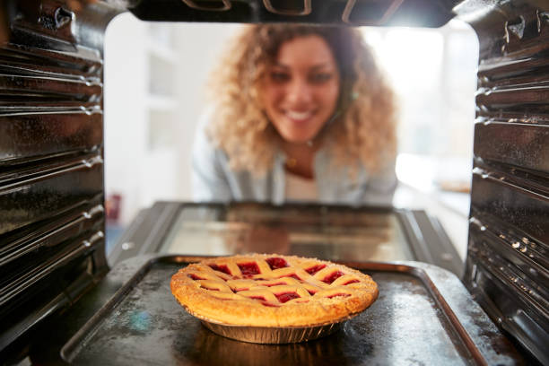 istock View Looking Out From Inside Oven As Woman Cooks Fruit Tart 1164895760