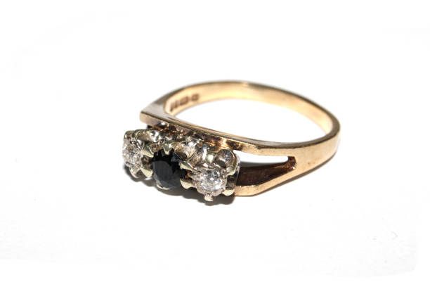 istock Close Up of a Expensive Diamond Ring On White Background 1164896669