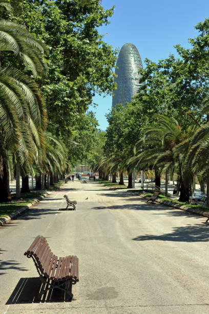 Barcelona: empty benches on avenida diagonal Barcelona, Spain - Mai 31, 2019: empty benches on the Avenida Diagonal, with Agbar tower in the background avenida diagonal stock pictures, royalty-free photos & images