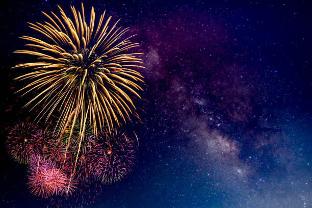 istock Fireworks with blur milky way background 1164898726