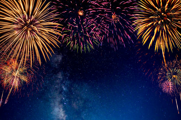 istock Fireworks with blur milky way background 1164898787