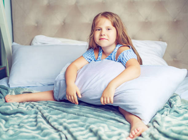 istock girl in bed 1164899453