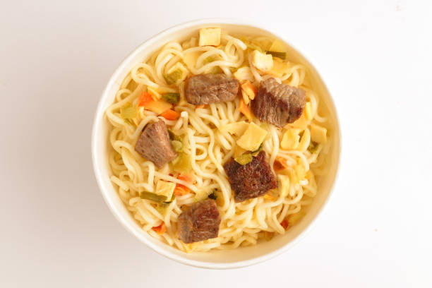 istock Paper cup with instant ramen noodles with beef and vegetables. 1164902583