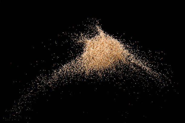 An extreme closeup of sand grains on a beach in New Jersey.  You can see the detail and coloration in each grain.