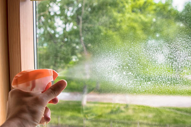istock window cleaner splashes onto glass 1164910349