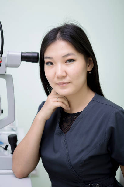 istock Female ophthalmologist at workplace 1164910534