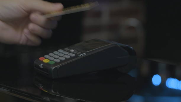 istock Close-up shot of person using mobile payment PayPass. 1164910543