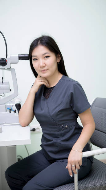 istock Female ophthalmologist at workplace 1164910569