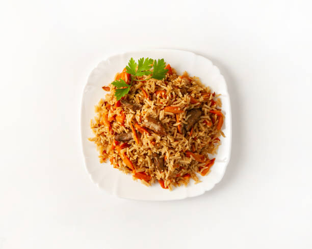 istock Plate of pilaf with beef on a white background top view 1164911513