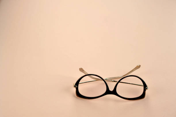 Women's glasses for reading. Light background. View from above. Free space to place text.