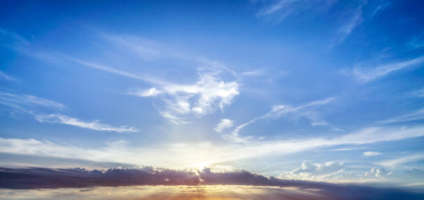 istock Majestic sun and clouds on blue sky 1164911731