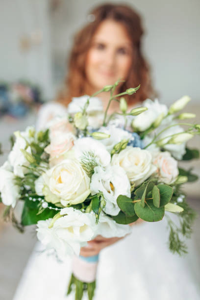 istock Beautiful bride in a wedding dress with lace, posing in the Studio 1164912083