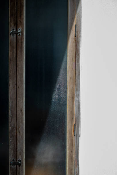 istock Frosted Glass and wooden door frame, Light & Shadow, Home concept 1164912131