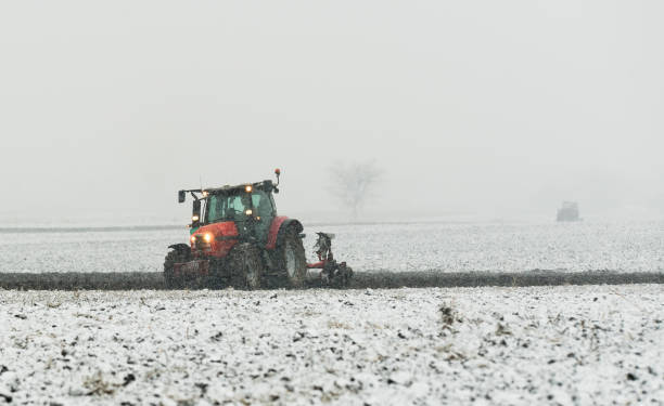 istock Tractor plowing a field in winter 1164913122