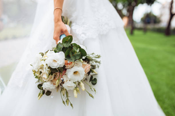 istock wedding flowers, bride holding beautiful flowers, decor 1164913267