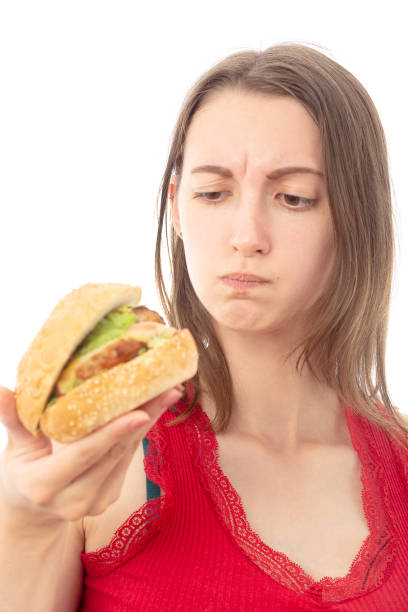 istock girl with hamburger 1164914492