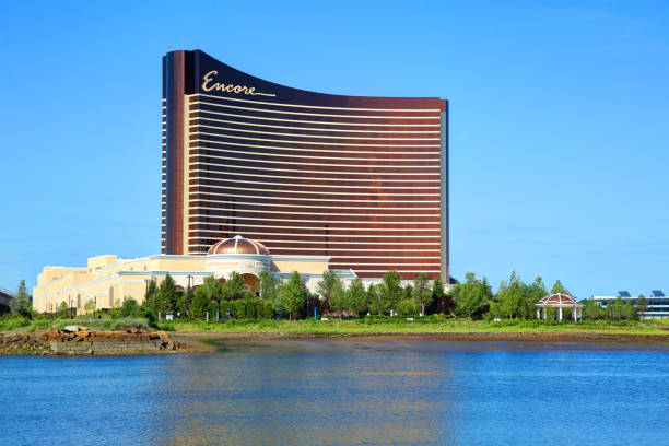 Encore Boston Harbor Casino Everett, Massachusetts, USA - July 15, 2019: Daytime view of the Encore Boston Harbor casino along the Mystic River in Everett boston harbor stock pictures, royalty-free photos & images