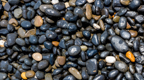 istock Black Volcanic Stones at Mavra Volia Beach 1164915361