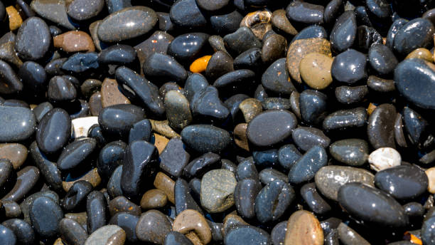 istock Black Volcanic Stones at Mavra Volia Beach 1164915367