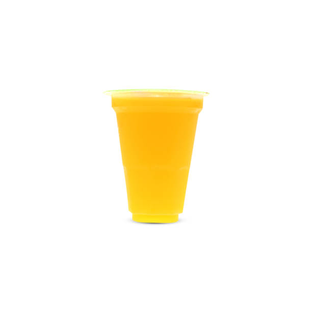 istock Orange juice in a plastic cup. Close the lid on a white background. 1164917186