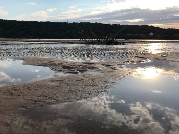 Arkansas river sandbar in Tulsa New sandbar emerging from the Arkansas river as the water level drops arkansas-river stock pictures, royalty-free photos & images