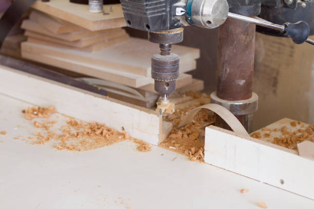 istock Boring machine with nozzle in the furniture workshop, selective focus 1164920536