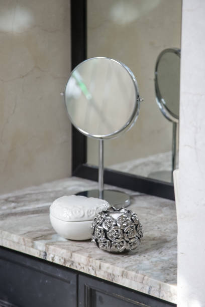 istock Vanity table, mirror and jewelry boxes on the elegant marble desk 1164922031
