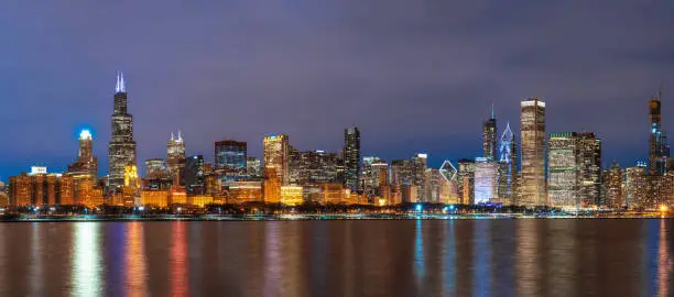 Photo of Panorama of Chicago Cityscape river side along Lake Michigan at beautiful twilight time, Illinois, United States, Business Architecture and building with tourist concept