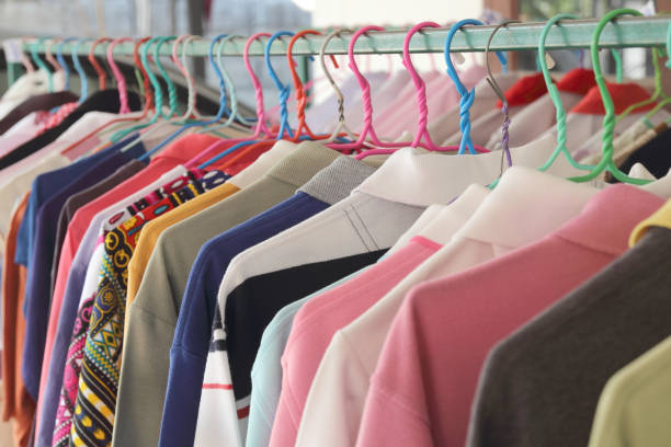 istock Collection of clothes hanging on a rack 1164922969
