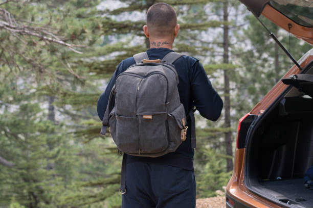 istock Man travel with car in mountains 1164925553