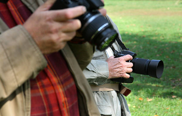 istock Men Holding DSLR Cameras at photo shoot 116493203