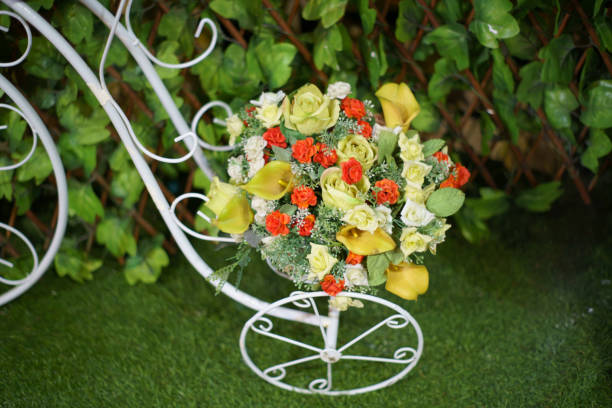 istock Small beautiful decorative white bicycle with flowers 1164933591