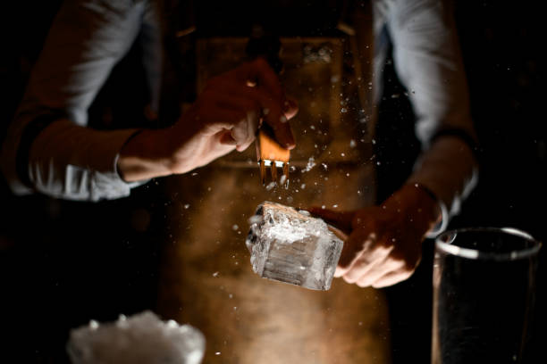 istock Bartender crushes piece of ice with picker 1164934937