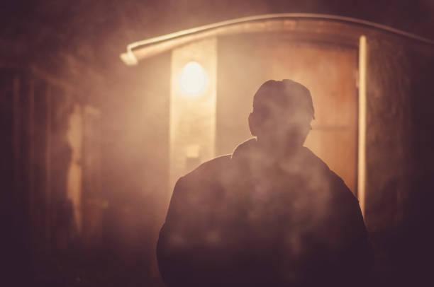istock smoking man in fume haze 1164935948