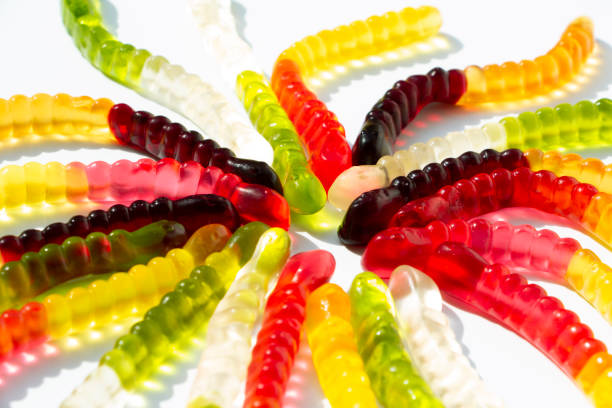 istock Coloured jelly worms funny background 1164937538
