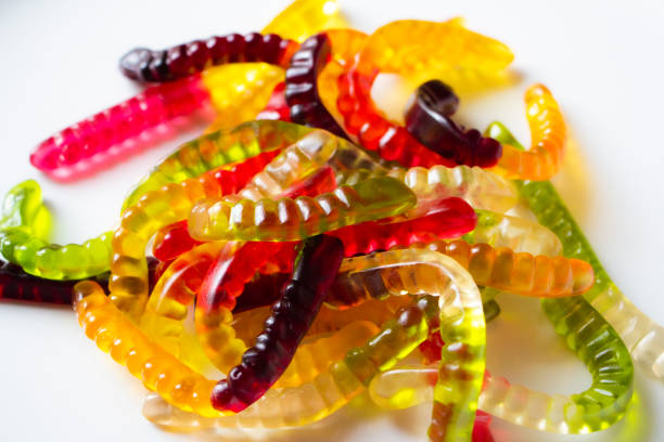 istock Coloured jelly worms funny background 1164937857